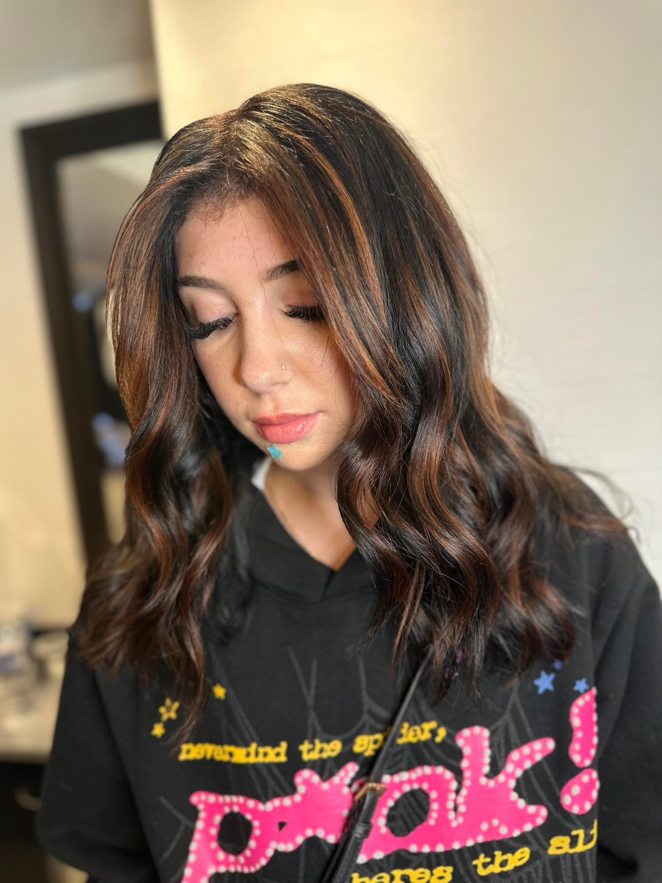 Bold Contrast Black Hair Enhanced by Copper Streaks